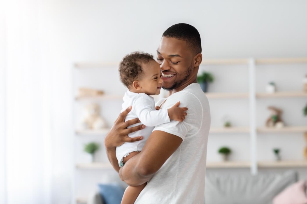 Father holding his little baby in his arms